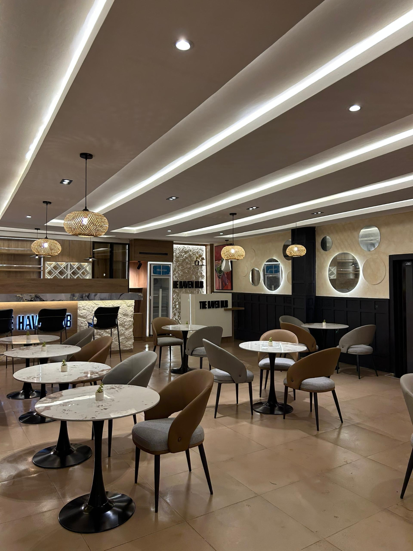 Wide view of The Haven Hub dining hall looking towards the bar