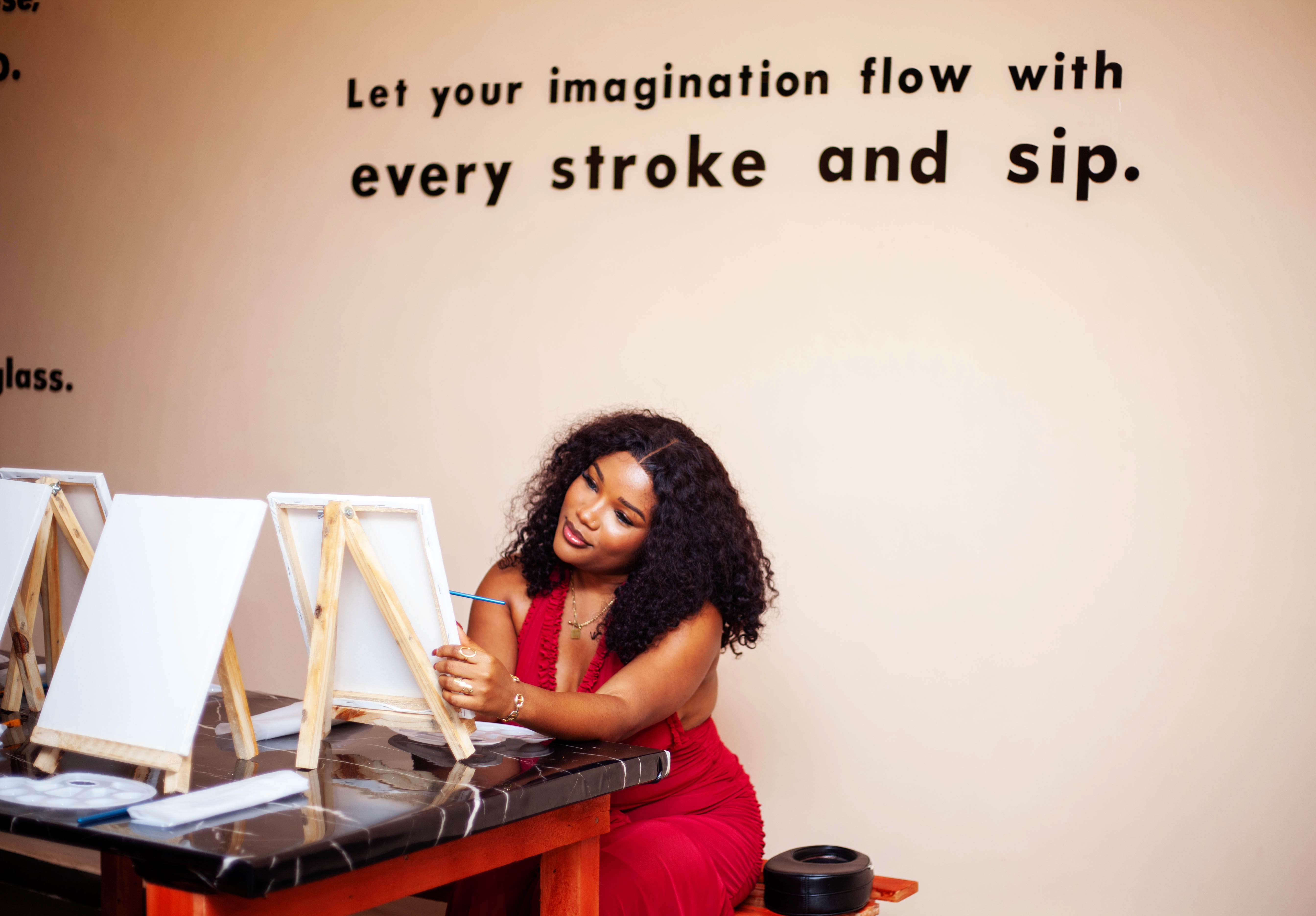 Guest painting at a sip and paint session at The Haven Hub